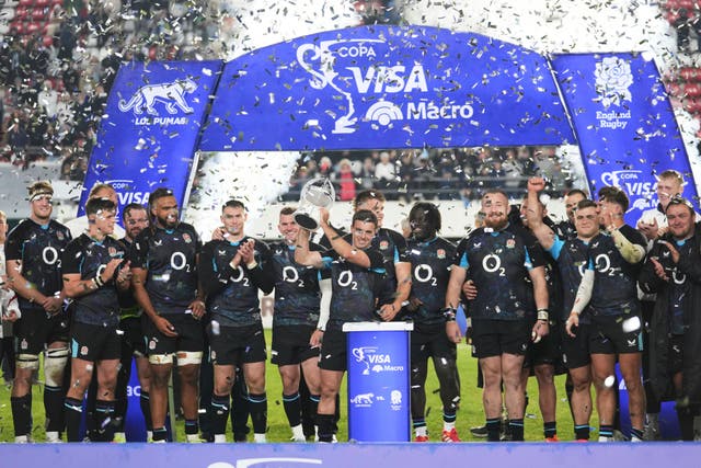 England celebrate their victory over Argentina (Gustavo Garello/AP)